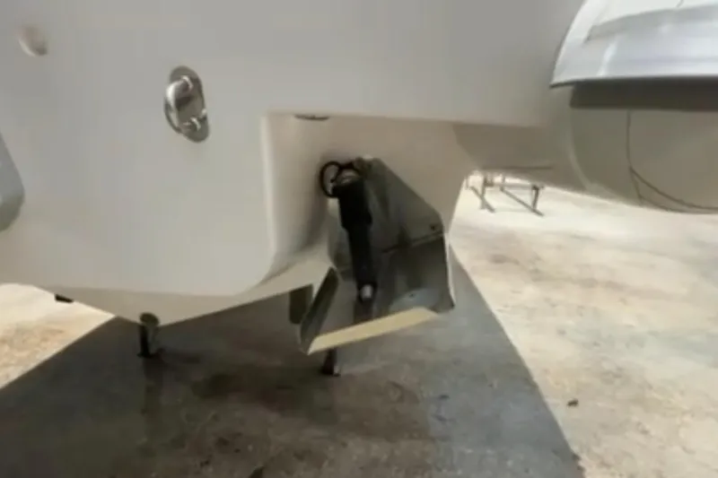 Slide: The Image of 2023 Airship 310-Rib boat with Mercury outboard motor docked by the water. - 7