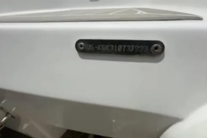 Slide: The Image of 2023 Airship 310-Rib boat on stands, showcasing hull and motor details. - 8