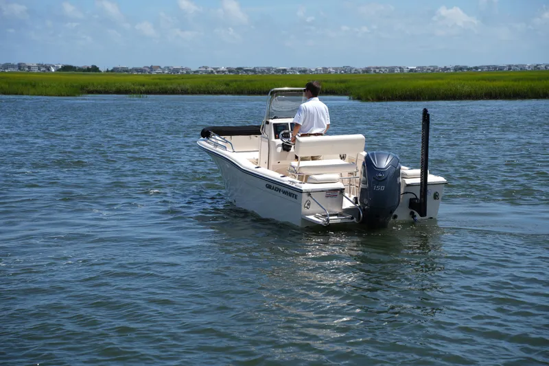 Slide: The Image of 2024 Grady-White Fisherman 180 boat cruising on a calm waterway. - 10
