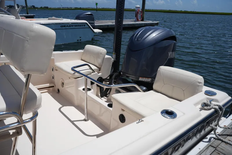 Slide: The Image of 2024 Grady-White Fisherman 180 boat with Yamaha engine docked by the water. - 13