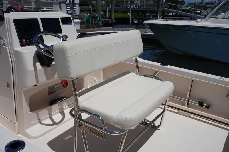 Slide: The Image of 2024 Grady-White Fisherman 180 boat interior with white seating and steering console. - 15