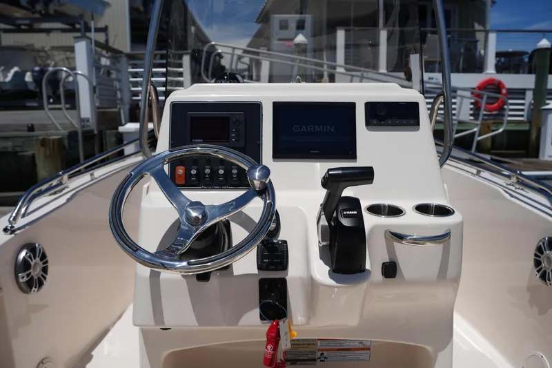 Slide: The Image of 2024 Grady-White Fisherman 180 boat console with Garmin display and Yamaha controls. - 16