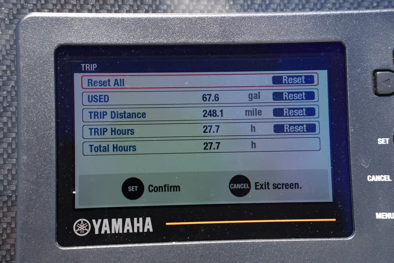 Slide: The Image of Yamaha display showing trip data: 67.6 gallons used, 248.1 miles, 27.7 hours. Grady-White Fisherman 180. - 19