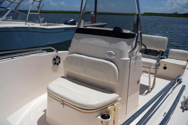 Slide: The Image of 2024 Grady-White Fisherman 180 boat interior with seating and console on water. - 23
