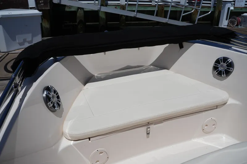 Slide: The Image of 2024 Grady-White Fisherman 180 boat interior with cushioned seating and speakers. - 26