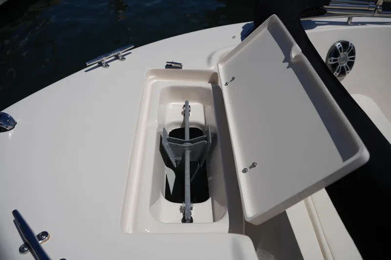 Slide: The Image of 2024 Grady-White Fisherman 180 anchor storage compartment with open lid. - 28