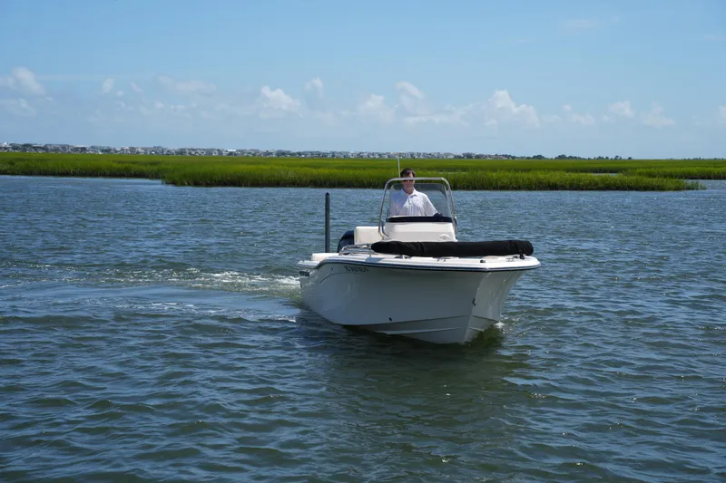 Slide: The Image of 2024 Grady-White Fisherman 180 boat cruising on a sunny day in open water. - 3