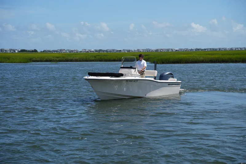 Slide: The Image of 2024 Grady-White Fisherman 180 boat cruising on a calm waterway. - 9