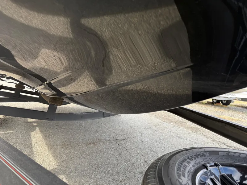 Slide: The Image of 2021 Skeeter ZX 150 boat hull and trailer, close-up view. - 19