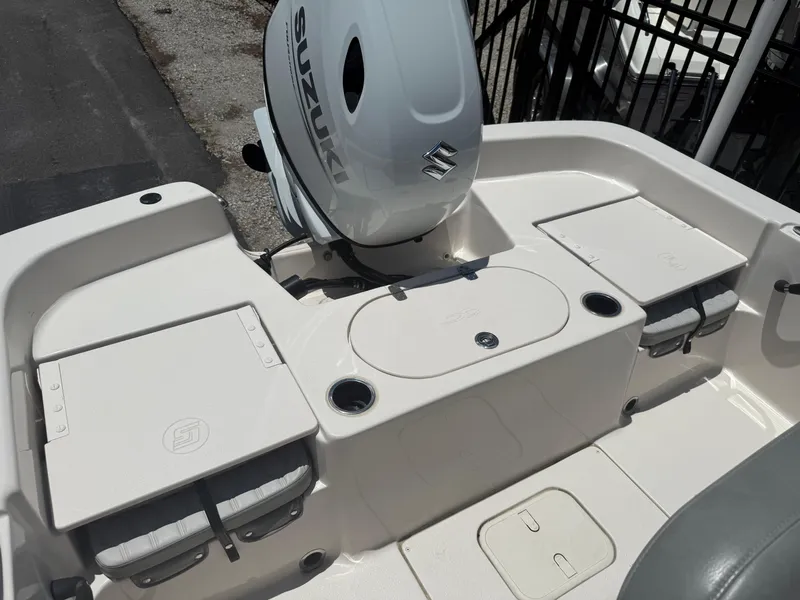 Slide: The Image of 2025 Carolina Skiff 19 LS boat with Suzuki outboard motor, featuring spacious seating and storage. - 13