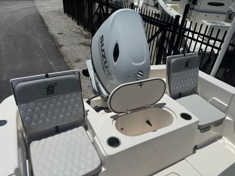 Slide: The Image of 2025 Carolina Skiff 19 LS boat interior with Suzuki engine and seating. - 14