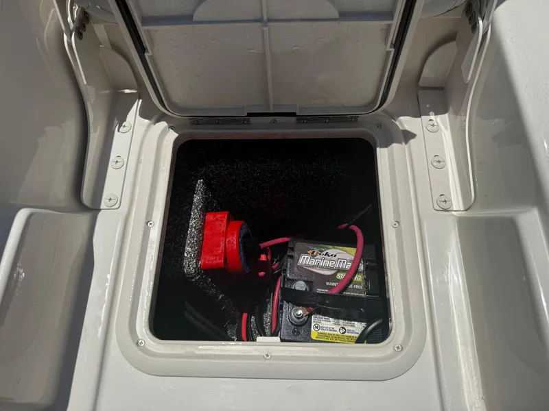 Slide: The Image of 2025 Carolina Skiff 19 LS boat battery compartment with Marine Master battery. - 17