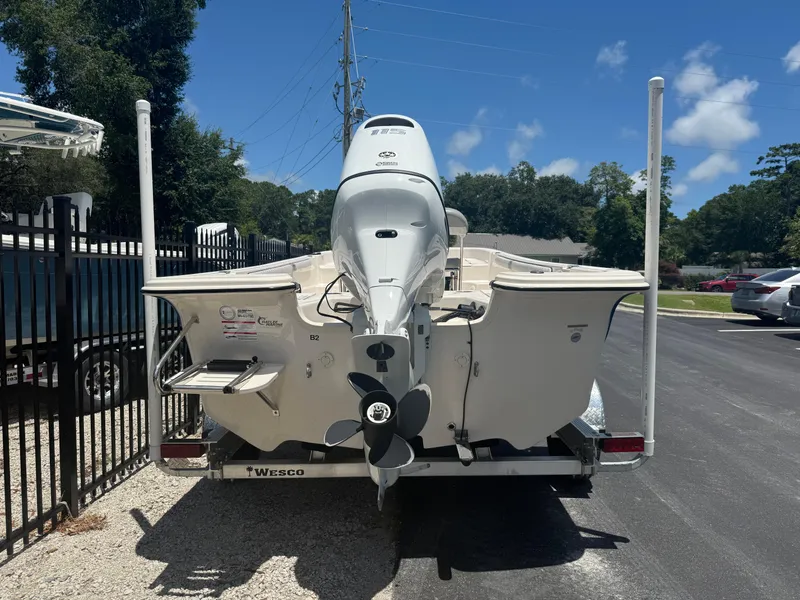 Slide: The Image of 2025 Carolina Skiff 19 LS boat on trailer, rear view, sunny day. - 3