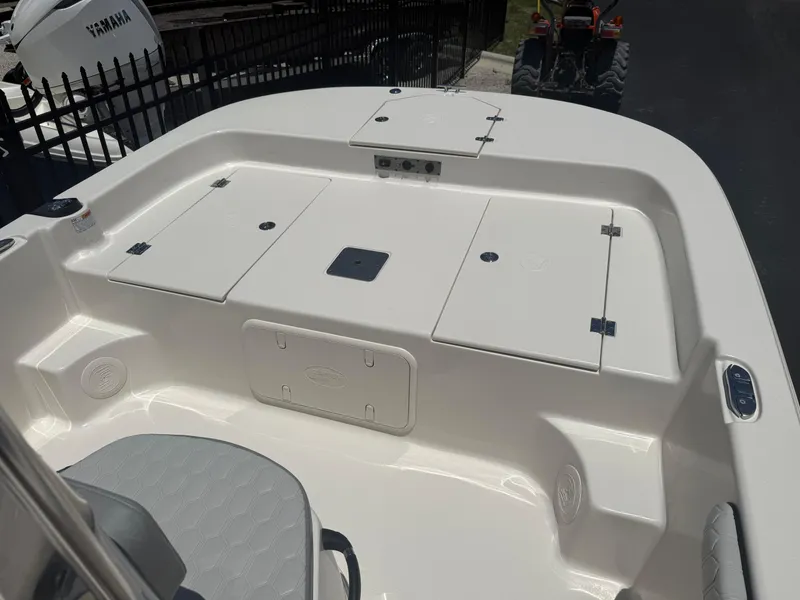Slide: The Image of 2025 Carolina Skiff 19 LS boat interior with storage compartments and seating. - 4