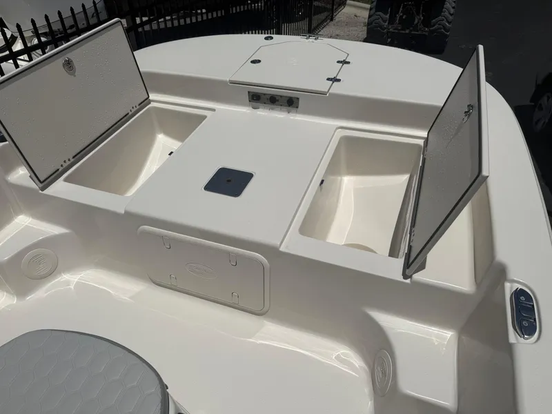 Slide: The Image of 2025 Carolina Skiff 19 LS boat interior with open storage compartments. - 5
