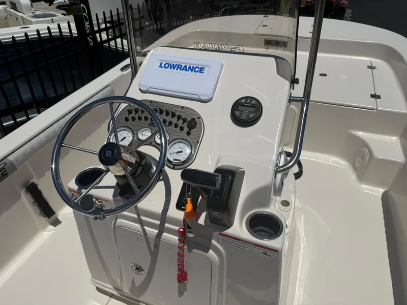 Slide: The Image of 2025 Carolina Skiff 19 LS boat console with steering wheel and Lowrance navigation system. - 8