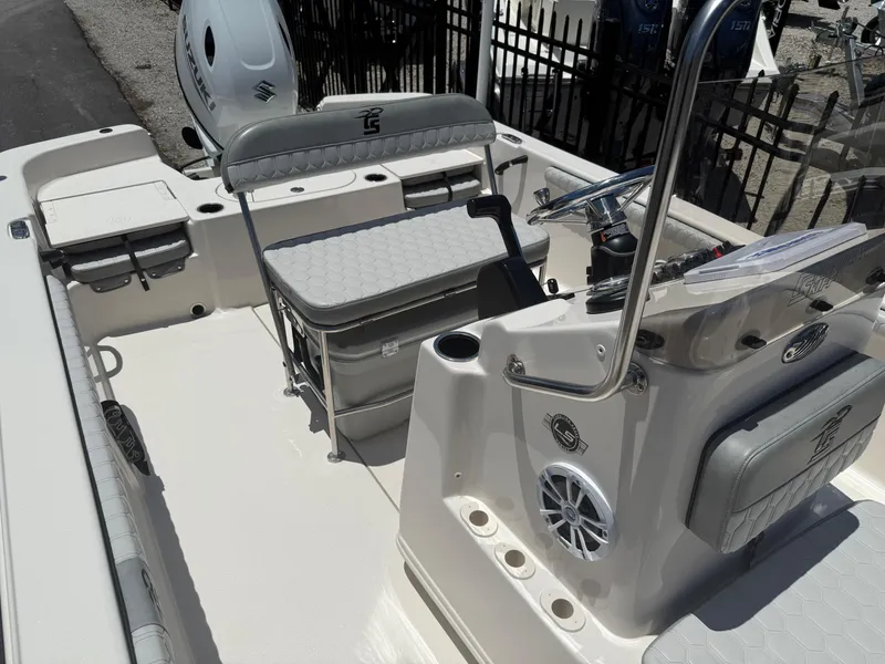 Slide: The Image of 2025 Carolina Skiff 19 LS boat interior with seating and steering console. - 9