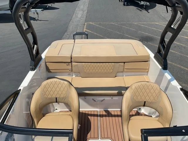 Slide: The Image of 2022 Bayliner VR4 Bowrider I/O interior with tan seating and sleek design. - 11
