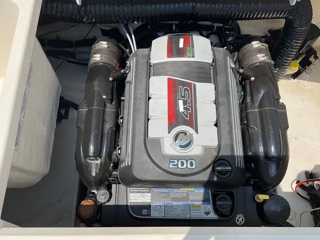 Slide: The Image of 2022 Bayliner VR4 Bowrider I/O engine compartment with 4.5L 200 HP engine. - 15