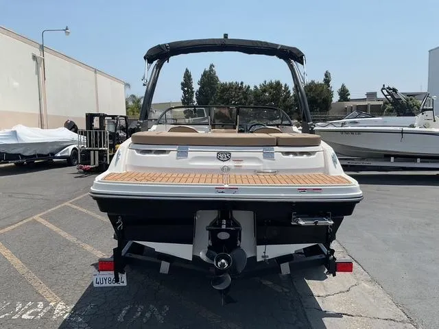Slide: The Image of 2022 Bayliner VR4 Bowrider I/O boat, rear view, parked outdoors on a sunny day. - 7
