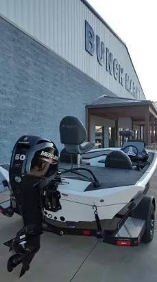 Slide: The Image of 2026 Vexus AVX181D boat with Mercury engine outside dealership. - 13