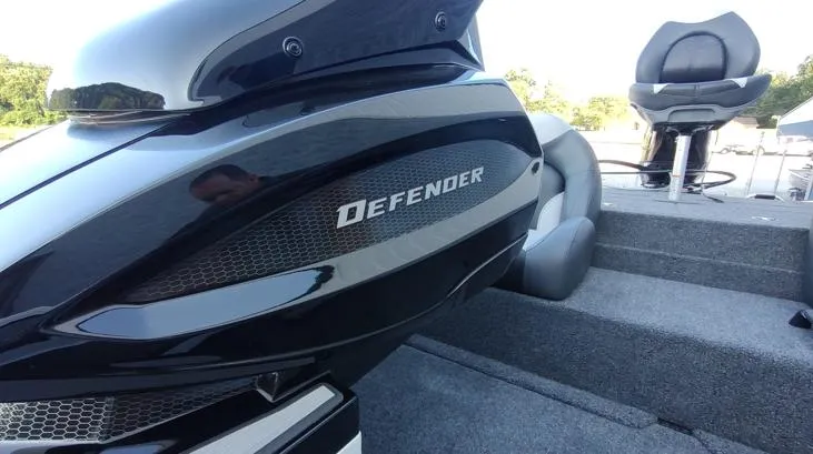 Slide: The Image of 2026 Vexus AVX181D boat interior with "Defender" branding, featuring sleek design and seating. - 8