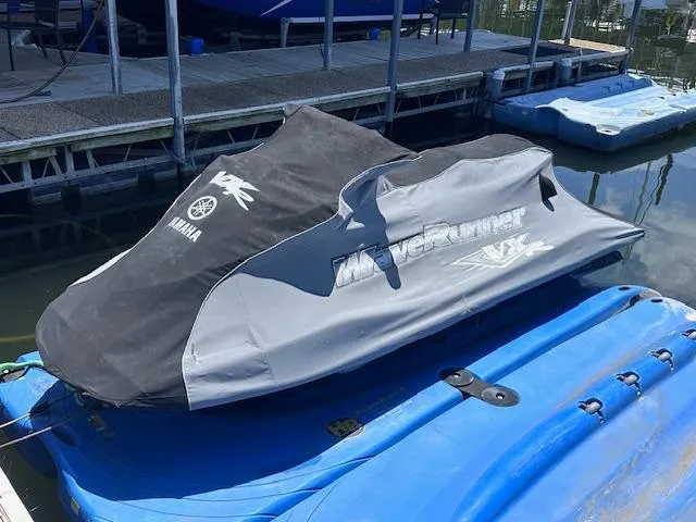 Slide: The Image of 2017 Yamaha WaveRunner VX Cruiser HO covered, docked on blue platform. - 2