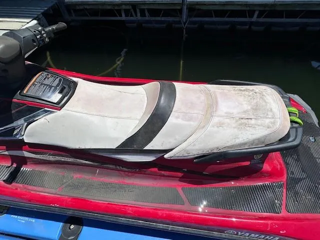 Slide: The Image of 2017 Yamaha WaveRunner VX Cruiser HO with red and white seat, docked by the water. - 9