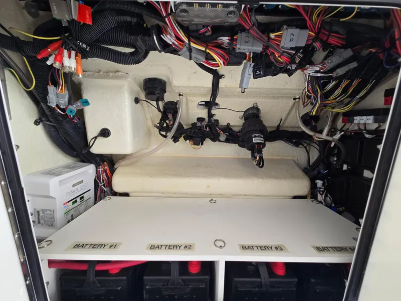Slide: The Image of Electrical system of 2023 Regulator 34 boat, showcasing wiring and battery compartments. - 13