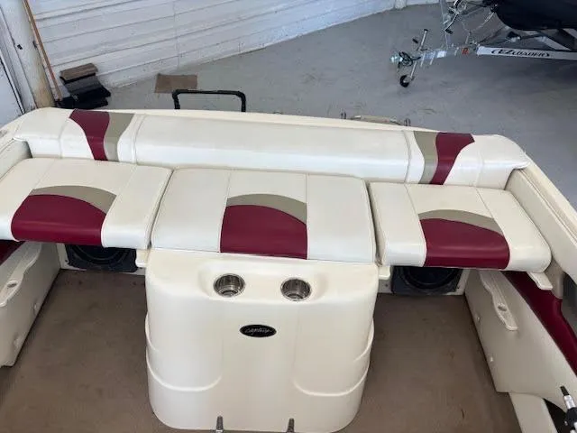 Slide: The Image of 2000 Rinker Captiva 212 boat interior with white and red seating. - 17