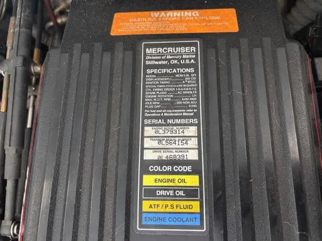 Slide: The Image of Engine cover of a 2000 Rinker Captiva 212 with MerCruiser specifications and serial numbers. - 19