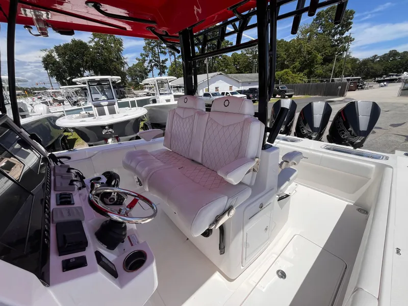 Slide: The Image of 2023 Fountain 38 Tournament Edition boat interior with luxurious seating and advanced controls. - 18