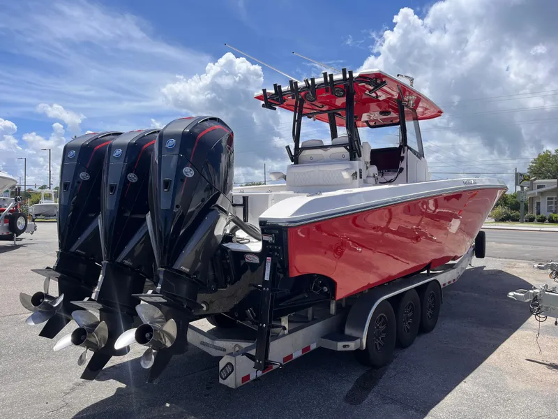 Slide: The Image of 2023 Fountain 38 Tournament Edition boat with triple outboard engines on a trailer. - 5