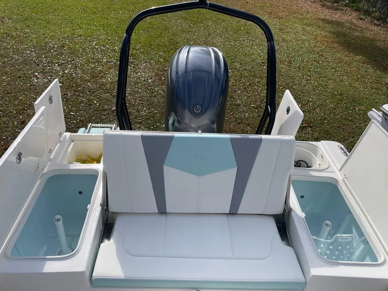 Slide: The Image of 2024 Robalo 226 Cayman boat interior with seating and storage compartments. - 19
