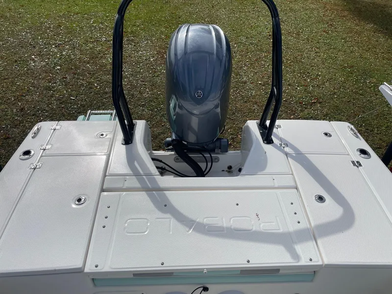 Slide: The Image of 2024 Robalo 226 Cayman boat with Yamaha outboard engine, rear deck view. - 20