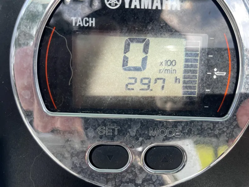 Slide: The Image of Yamaha tachometer displaying 29.7 hours on a 2024 Robalo 226 Cayman boat. - 4