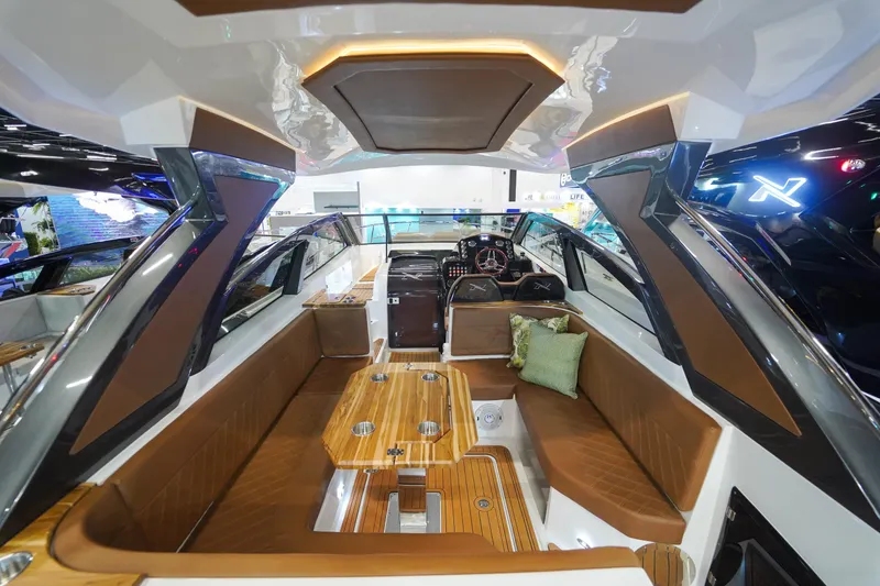 Slide: The Image of 2024 NX Boats NX360 Sports Coupe interior with luxurious seating and modern design. - 4