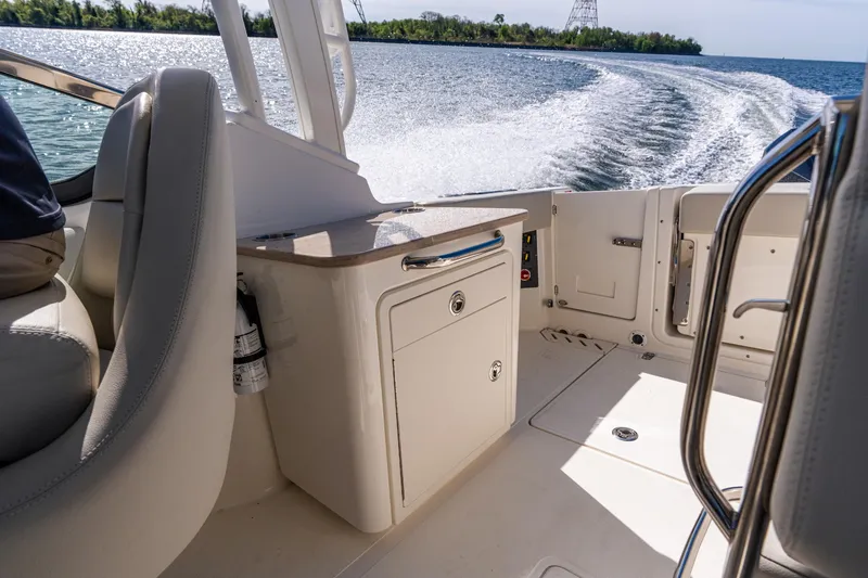 Slide: The Image of 2022 Boston Whaler 240 Vantage interior with water view and seating. - 20