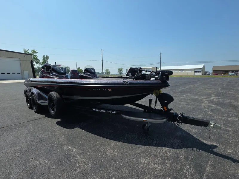 The Image of 2023 Ranger Z520R 55th Anniversary Limited Edition boat on trailer in parking lot. - 0