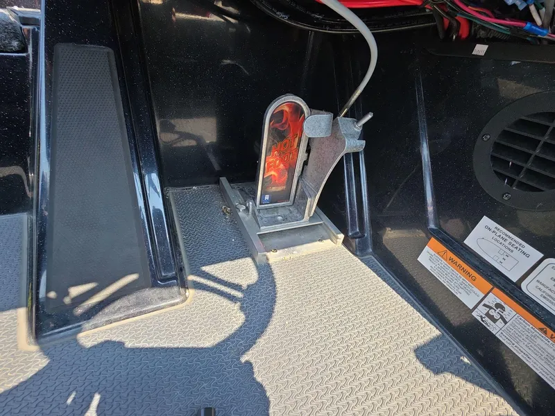 Slide: The Image of 2023 Ranger Z520R 55th Anniversary Limited Edition boat foot pedal and interior details. - 15