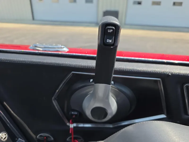 Slide: The Image of 2023 Ranger Z520R 55th Anniversary Limited Edition control lever with "UP" and "DN" buttons. - 7