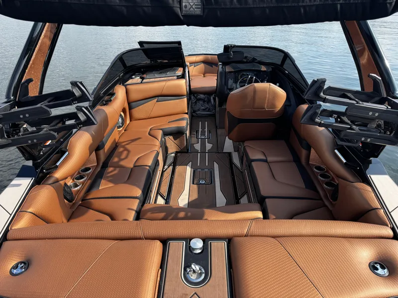 Slide: The Image of Luxurious interior of 2022 Centurion Fi23 boat with brown leather seating and sleek design. - 16