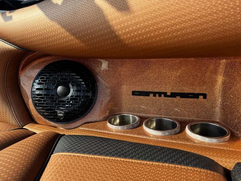 Slide: The Image of 2022 Centurion Fi23 interior with speaker, cup holders, and logo detail. - 18