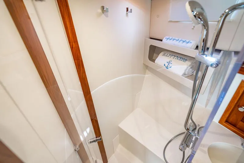 Slide: The Image of 2024 MJM 4 yacht bathroom with modern shower and wooden accents. - 33