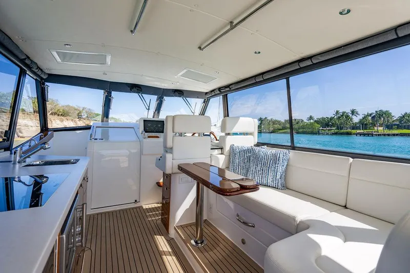 Slide: The Image of Luxurious interior of 2024 MJM 4 yacht with panoramic windows and elegant seating. - 49