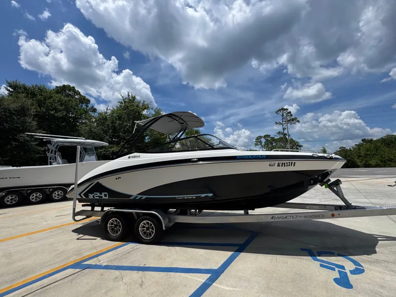 Slide: The Image of 2015 Yamaha AR240 HO boat on trailer under blue sky with clouds. - 10