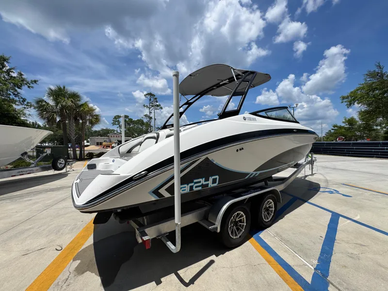 Slide: The Image of 2015 Yamaha AR240 HO boat on trailer under blue sky. - 12