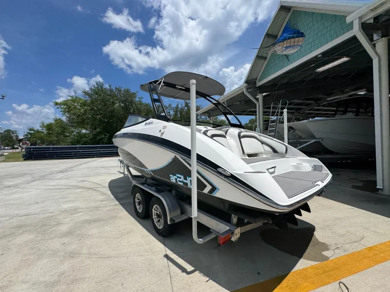Slide: The Image of 2015 Yamaha AR240 HO boat on trailer under clear blue sky. - 17
