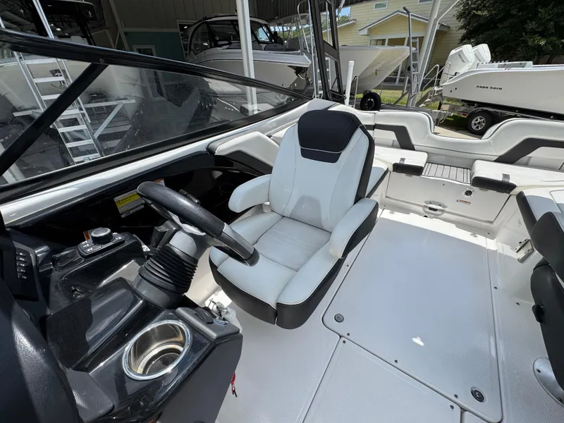 Slide: The Image of 2015 Yamaha Boats AR240 HO interior with steering wheel and seating. - 24
