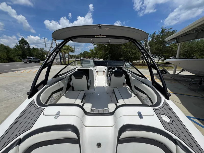 Slide: The Image of 2015 Yamaha Boats AR240 HO with spacious seating and sleek design under a clear sky. - 35